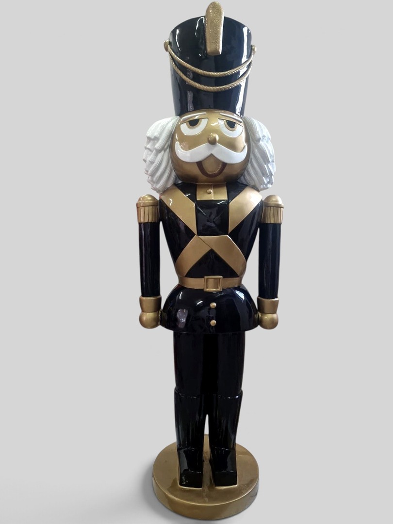 Schwarz-goldener Nussknacker Soldat mit weißem Haar und Schnurrbart, dekorative Figur.